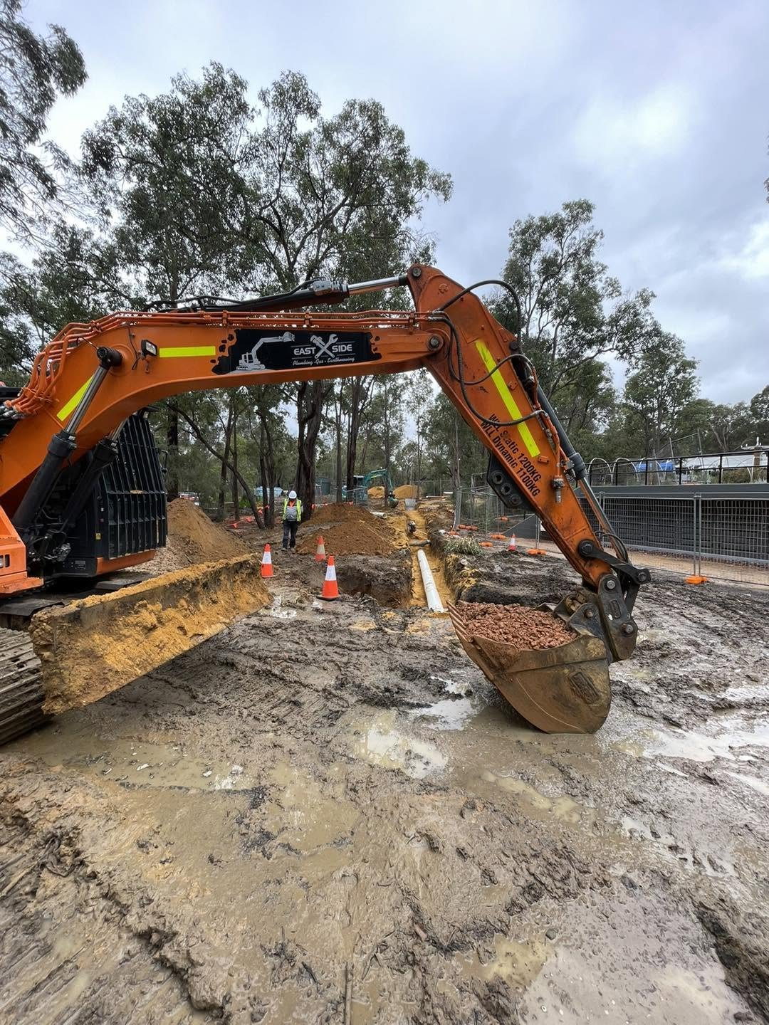 Gidge Civil excavator parked on a cleared Perth Hills earthworks site