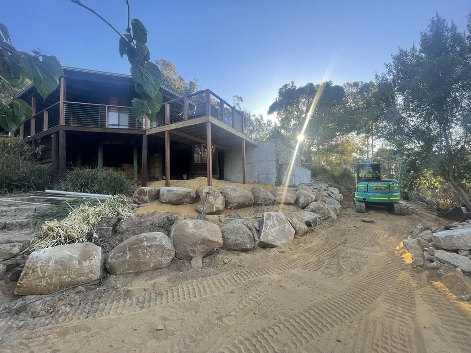 Rock retaining wall built to level a steep Perth Hills block